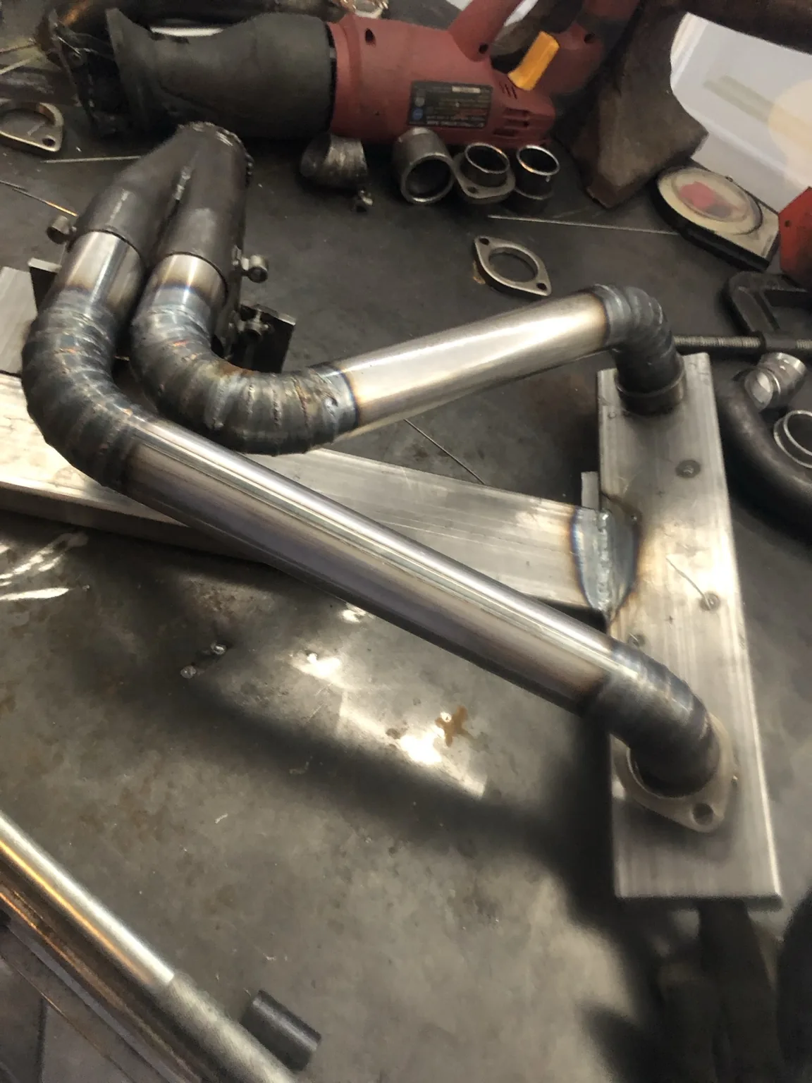Pie cut exhaust tubes during fabrication
